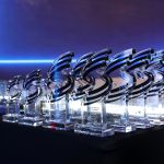 Close-up of custom crystal trophies displayed at a corporate awards ceremony during the UAE Annual Regional Audit Conference