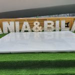 Elegant wedding dance floor setup with decorative lighting and personalized design elements